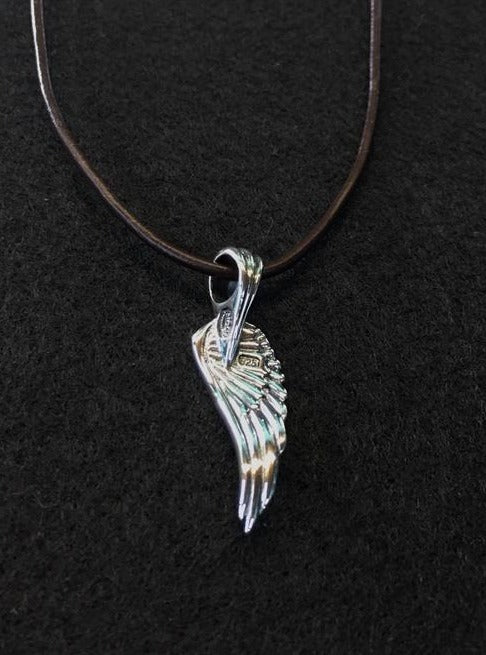 glide pendant of back side ,meaning : rise above a challenge.