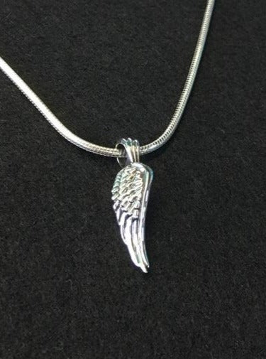  glide pendant with silver necklace. meaning : rise above a challenge.
