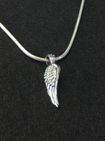 Load image into Gallery viewer,  glide pendant with silver necklace. meaning : rise above a challenge.
