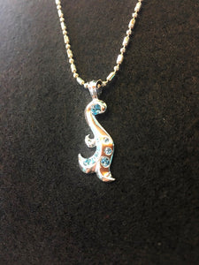 mermaid pendant top of back side with silver ball chain.