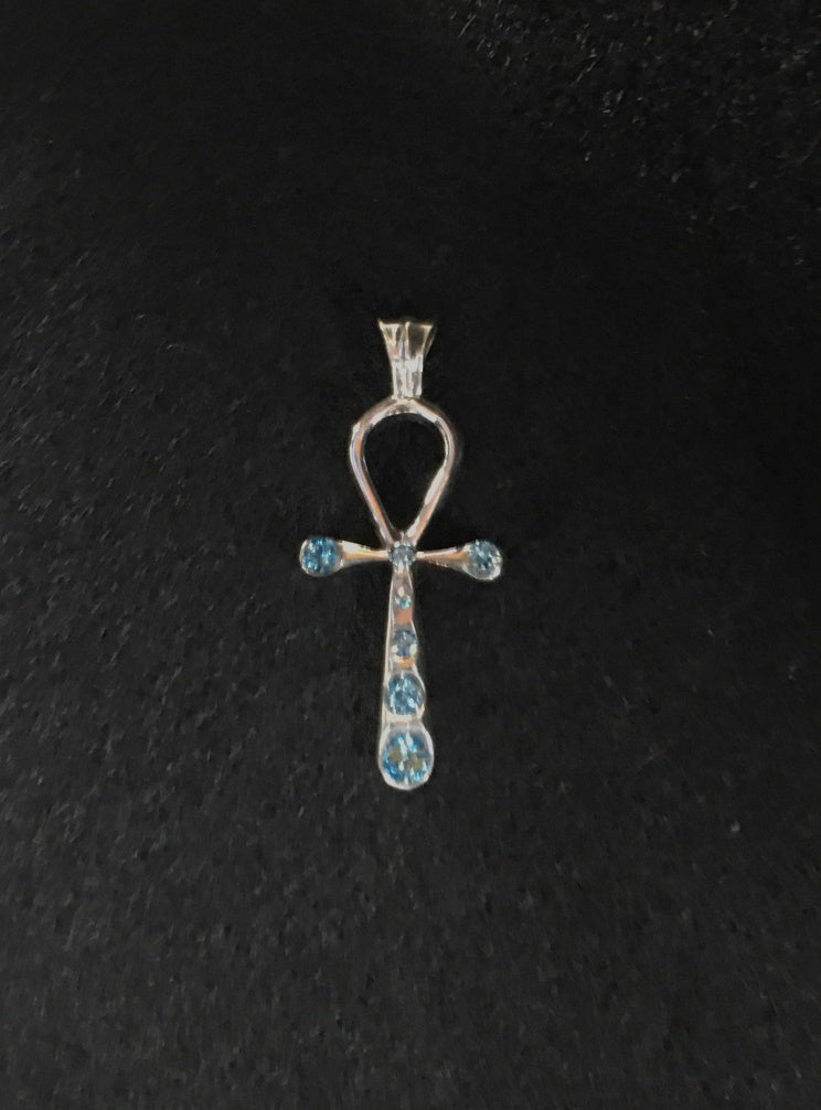 nefertiti pendant top of swarovski's light blue color. meaning:mysterious beauty