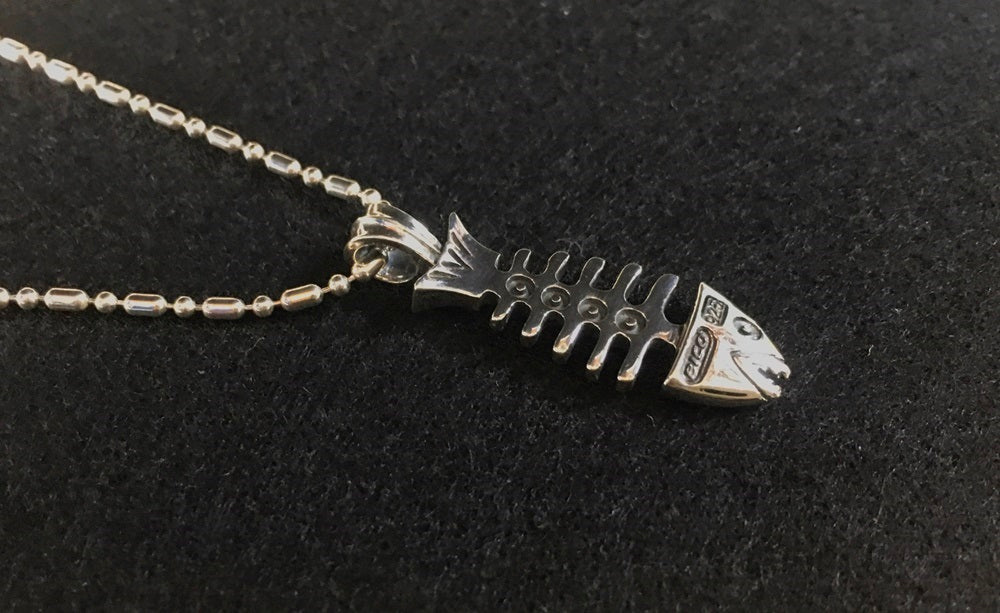 the fish pendant top with silver ball chain. meaning:friendship and sensitivity.