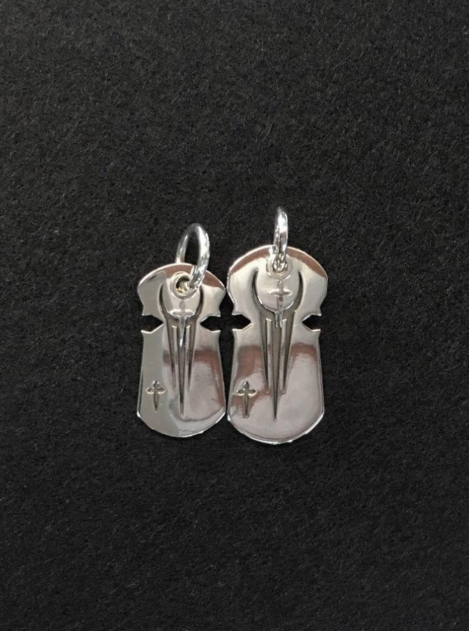 under world twin pendants with silver cross. .meaning: unforsaken connection bond without boundaries.A matching pair of pendants with silver and gold plating sold as a set that are ideal to be split between loved ones or friends.