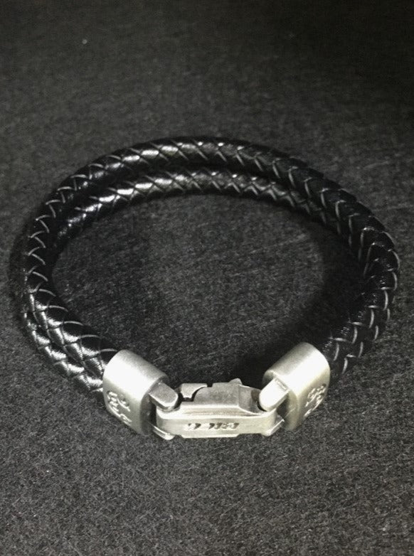 Wrangler-Black-Leather-Bracelet. A Bico classic black leather double .24″ (6mm) bracelet combined with a solid pewter connector oxidised black and then hand brushed to create highlights and a matte finish.