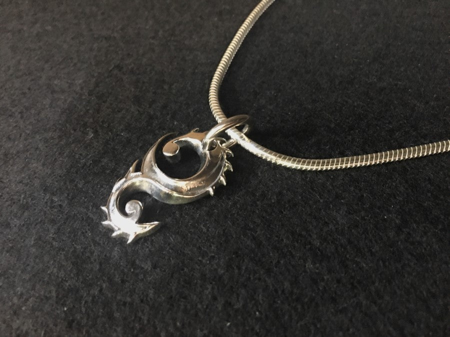 dragon-flame-pendant-with-silver-necklace. meaning : guardian-of-prosperity