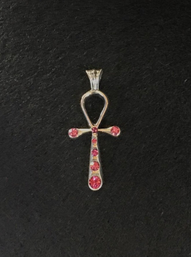 nefertiti pendant top of swarovski's pink color. meaning:mysterious beauty